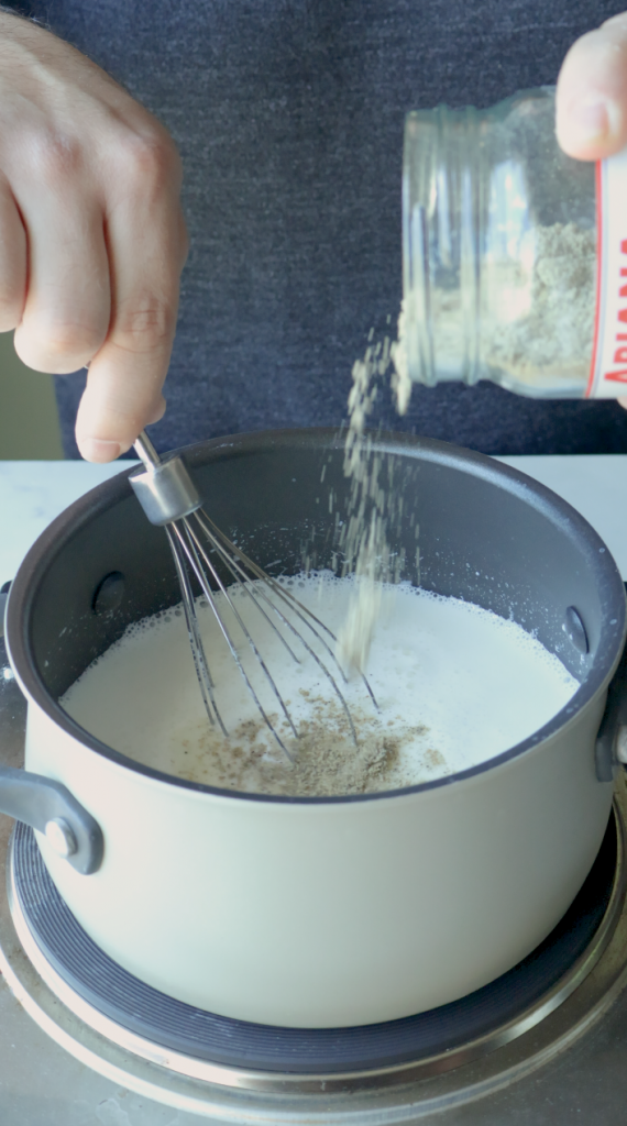 5. Make sure to stir constantly to avoid the milk sticking.
6. Then add sugar, ground cardomom, and the vanilla.